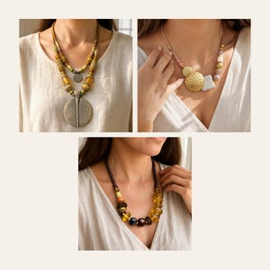 May include: Three necklaces featuring varied bead designs. The first has amber-toned beads and a large circular pendant. The second displays gold-toned hammered discs and light-colored beads. The third features dark brown, amber, and yellow beads.