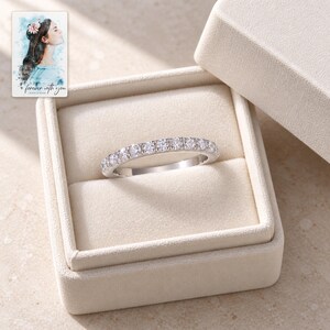 Moissanite Half Eternity Ring, displayed in a presentation box. A sample personalized digital greeting card is shown alongside.