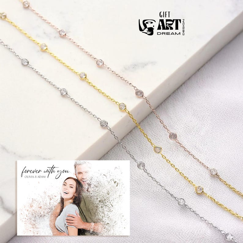 May include: Four delicate chain necklaces in silver, gold, and rose gold, each adorned with sparkling round gemstones. A small card with the text "forever with you" and a couple's photo is in the lower left corner. The logo "GIFT ART DREAM DESIGN" is in the upper right.