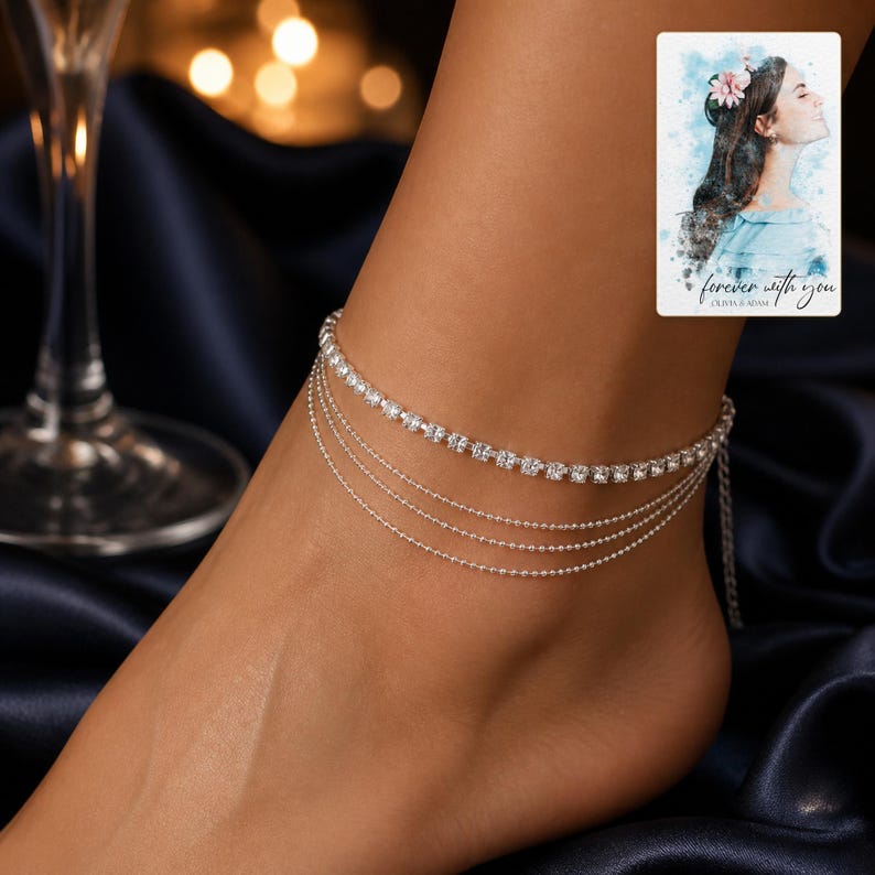 Silver Starlight Layered Anklet arranged on soft ivory linen in a refined neutral flat lay.