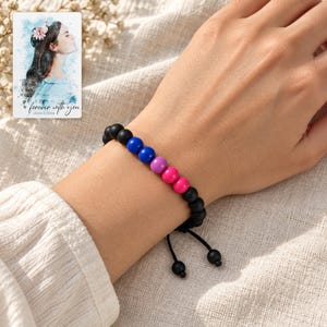 Black Bead Bracelet, worn lifestyle view. A personalized digital greeting card is shown alongside.