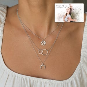 Silver Moon Map Layers worn by an adult in a polished evening lifestyle scene.