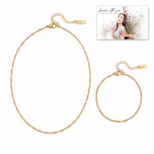 Golden Waterline Chain shown during a believable gift-giving moment between adults with the exact jewelry visible.