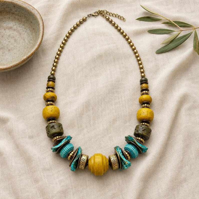 Rose Gold and Gray Statement Beaded Necklace presented in an open jewelry gift box on natural linen