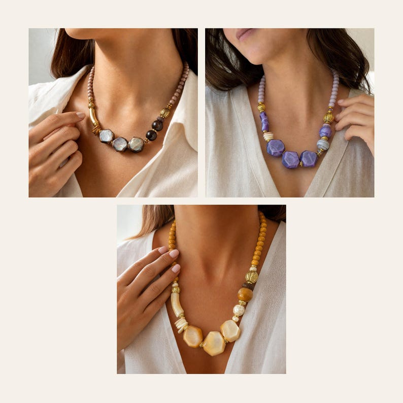 May include: Three necklaces featuring varied bead shapes and textures. The first has dark grey and metallic accents. The second displays purple faceted beads with light lavender spheres. The third showcases cream and amber-toned beads with gold spacers.