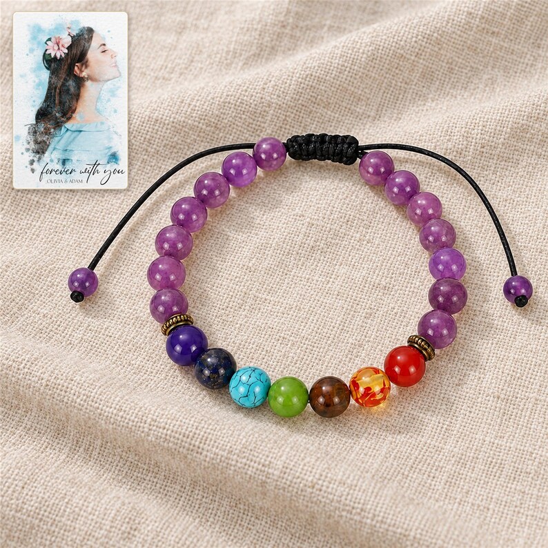 Violet Spectrum Cord Bracelet arranged on soft ivory linen in a refined neutral flat lay. A personalized digital greeting card is shown alongside.