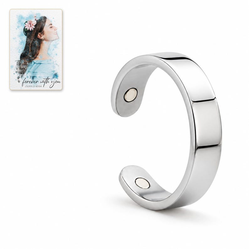 Silver-tone open C-shaped ring photographed on white with both rounded ends and inner circular details visible. A personalized digital greeting card is shown alongside.