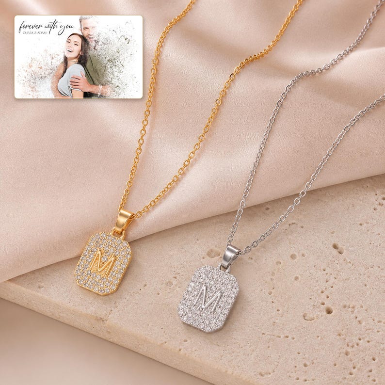 Mosaic Initial M Necklace Duo photographed in warm natural window light in an elegant home setting.