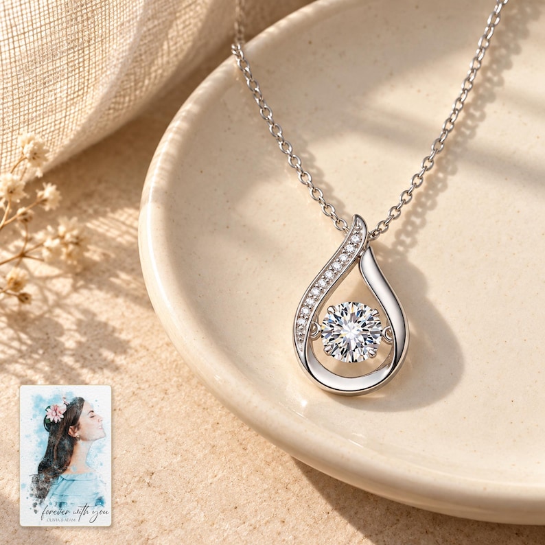 Moissanite Teardrop Necklace, shown in natural light. A sample personalized digital greeting card is shown alongside.