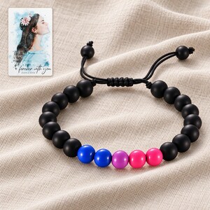 Black Bead Bracelet, linen flatlay view. A personalized digital greeting card is shown alongside.