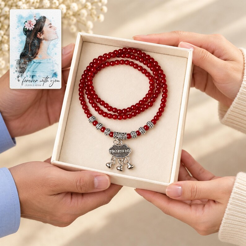 Crimson Agate style Charm Wrap Bracelet shown during a believable gift-giving moment between adults with the jewelry visible. A personalized digital greeting card is shown alongside.