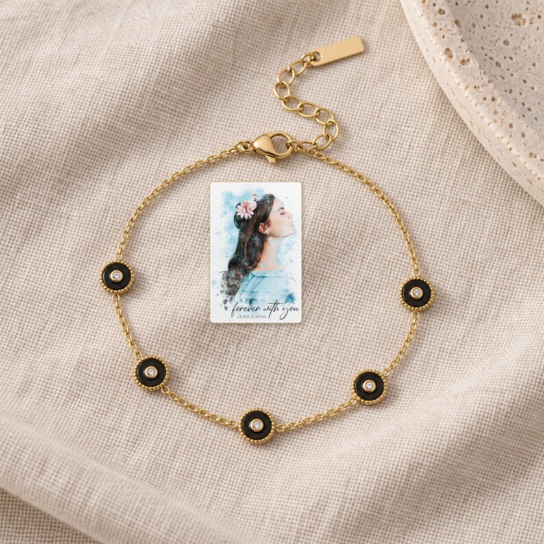 Black Disc Bracelet, laid on fabric. A sample personalized digital greeting card is shown alongside.