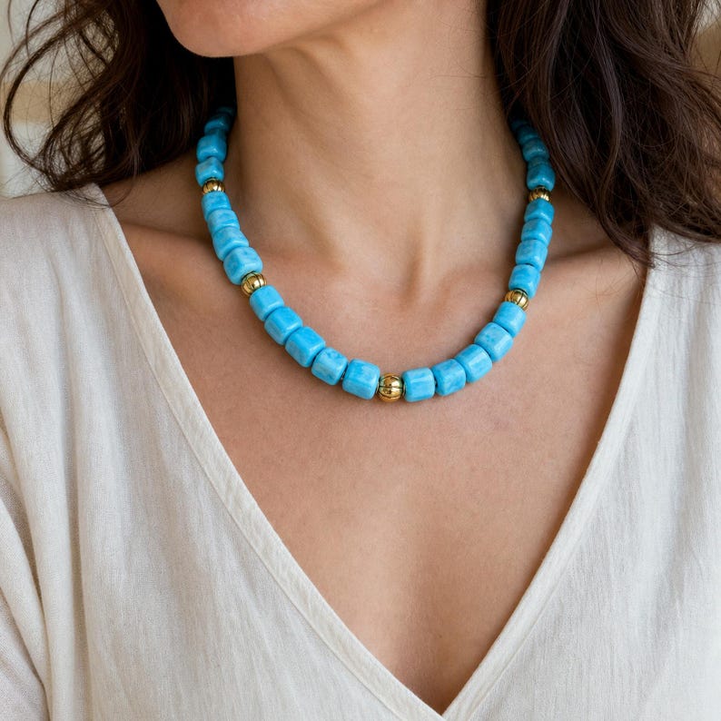 Gray and Silver Statement Beaded Necklace presented in an open jewelry gift box on natural linen