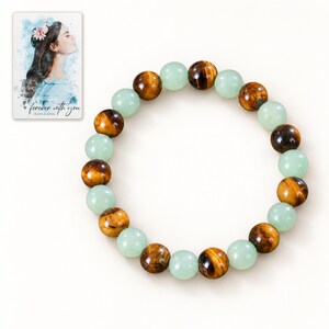 Forest Amber Bead Bracelet shown on a clean white catalog background for an unobstructed product view. A personalized digital greeting card is shown alongside.