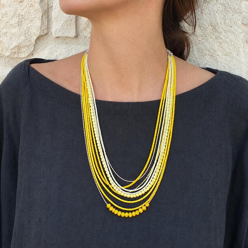 Yellow and Gold Statement Beaded Necklace, Boho Handmade Jewelry, Artisan Gift for Her worn with an ivory linen top in warm natural window light