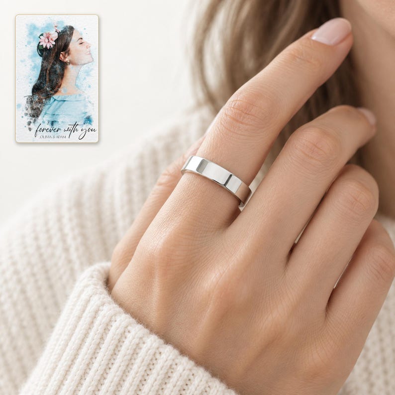 An adult woman wearing the polished silver-tone open band ring in a close daylight hand portrait. A personalized digital greeting card is shown alongside.