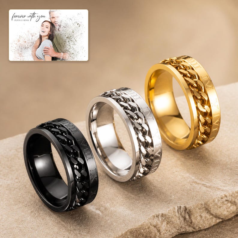 CipherSpin Roman Chain Ring photographed in warm natural window light in an elegant home setting.