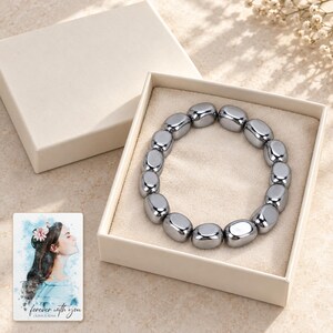 Metallic Grey Bead Bracelet, gift box view. A personalized digital greeting card is shown alongside.