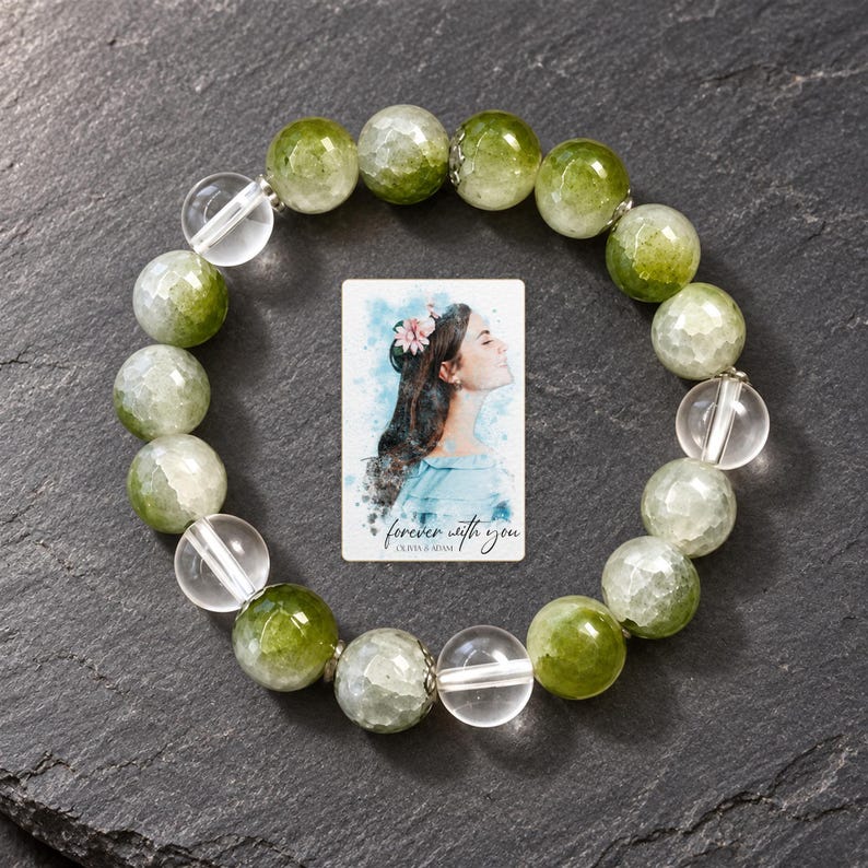Forest Dew Bead Bracelet styled against a dark luxury surface with the exact product finish clearly visible. A personalized digital greeting card is shown alongside.