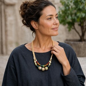 Three-piece handmade necklace set featuring clear and beige beaded necklace, rose gold and gray beaded necklace and brown and silver beaded necklace, displayed together to show the coordinated colors and beadwork