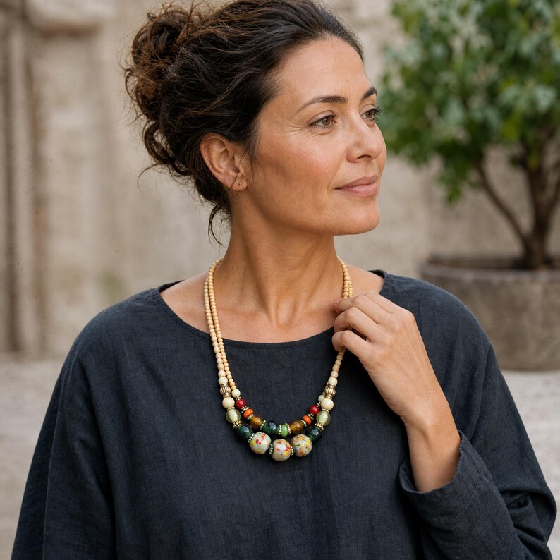 Three-piece handmade necklace set featuring clear and beige beaded necklace, rose gold and gray beaded necklace and brown and silver beaded necklace, displayed together to show the coordinated colors and beadwork