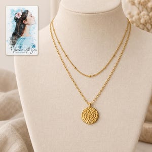 Gold Tone Coin Satellite Necklace shown on a clean white catalog background for an unobstructed product view. A personalized digital greeting card is shown alongside.