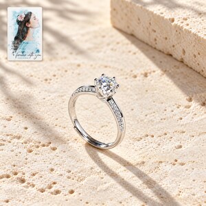 Moissanite Solitaire Ring, shown in natural light. A sample personalized digital greeting card is shown alongside.