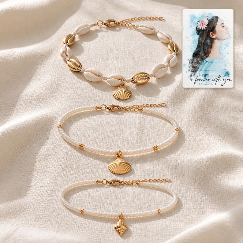 May include: A set of three bracelets featuring a cowrie shell bracelet with gold accents, a pearl-like beaded bracelet with a gold scallop shell charm, and a pearl-like beaded bracelet with a small gold shell charm, plus a card reading forever with you.
