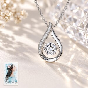 Moissanite Teardrop Necklace, close-up of the details. A sample personalized digital greeting card is shown alongside.