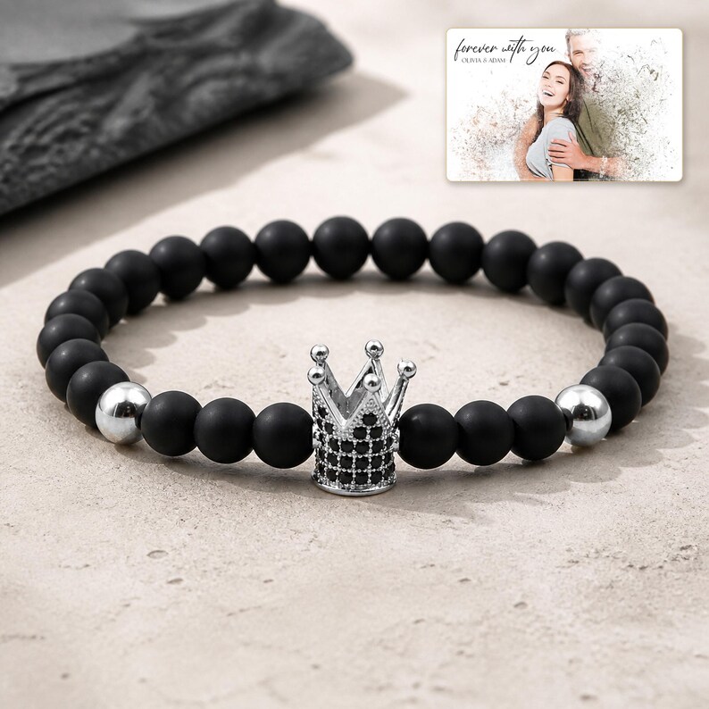 Midnight Crown Bead Bracelet photographed in warm natural window light in an elegant home setting.