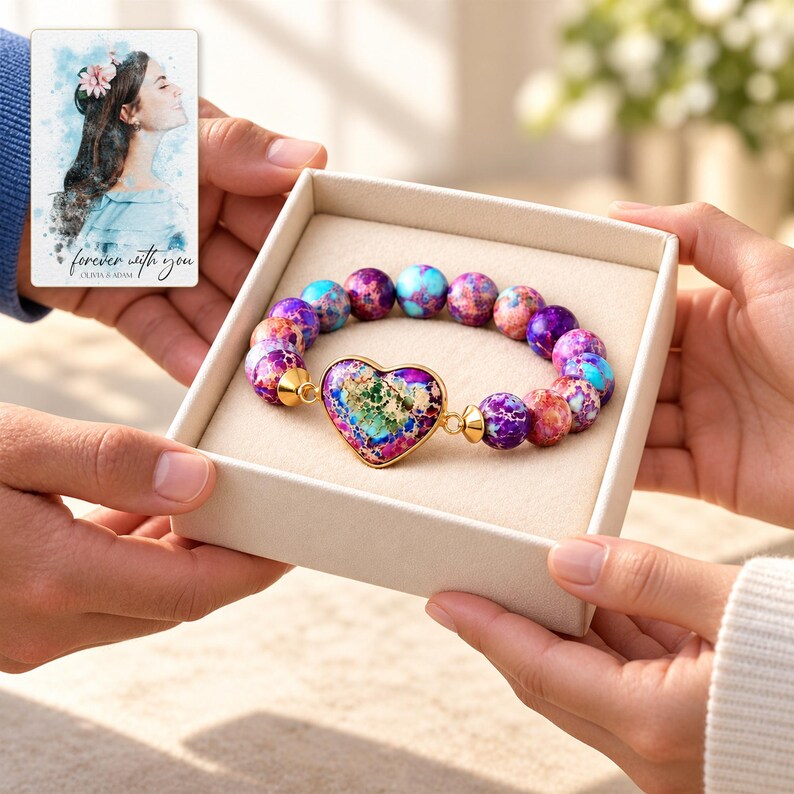 Imperial Mosaic Heart Bracelet shown during a believable gift-giving moment between adults with the jewelry visible. A personalized digital greeting card is shown alongside.