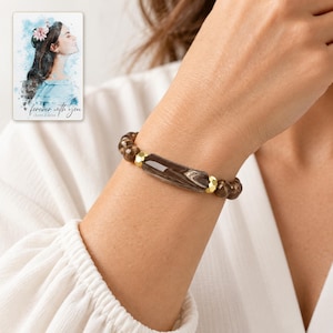 Cocoa Swirl Bar Bracelet worn by an adult model for styling and everyday styling. A personalized digital greeting card is shown alongside.
