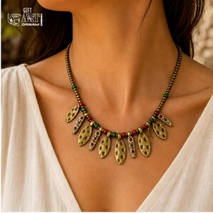 Antique Gold Leaf Charm Necklace presented in an open jewelry gift box on natural linen