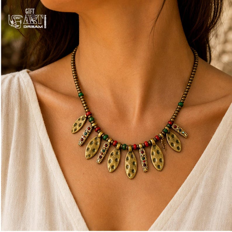 Antique Gold Leaf Charm Necklace presented in an open jewelry gift box on natural linen