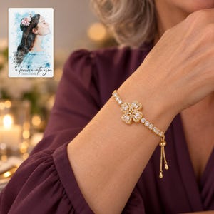 Golden Petal Slider Bracelet worn by an adult in a polished evening lifestyle scene. A personalized digital greeting card is shown alongside.