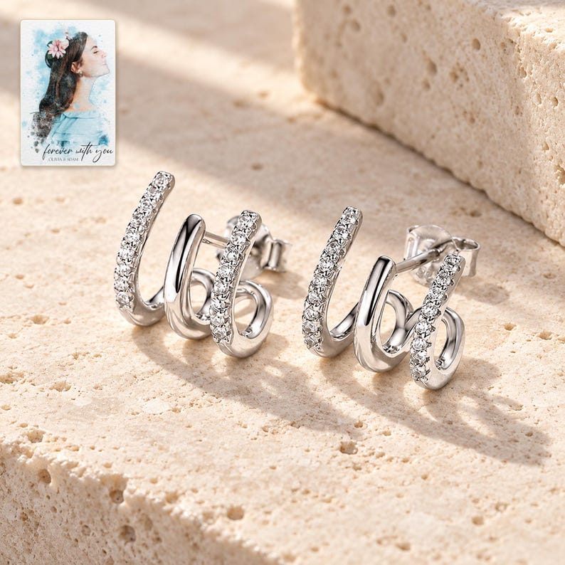 Triple Arc Stud Earrings, shown in natural light. A sample personalized digital greeting card is shown alongside.