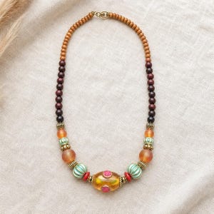 Red beaded necklace with colorful teardrop focal beads from the four piece boho jewelry set