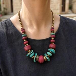 Three-piece handmade necklace set featuring rose gold and gray beaded necklace, rose gold and gray beaded necklace and rose gold and gray beaded necklace, displayed together to show the coordinated colors and beadwork