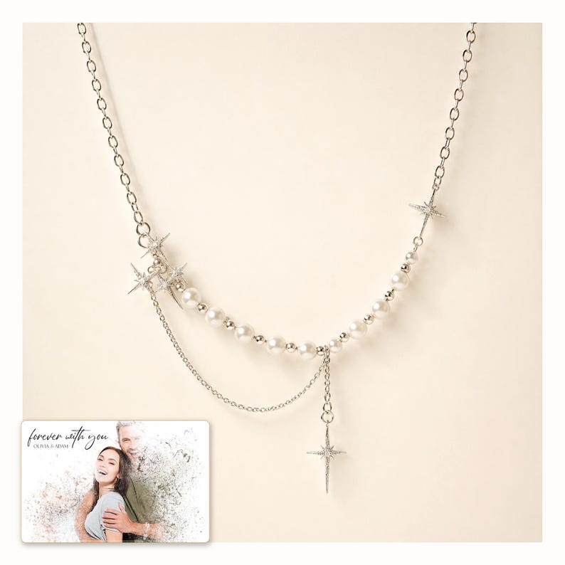 Silver-tone layered necklace with pale beads and pointed star charms, catalog view. A personalized greeting-card example appears in the corner.