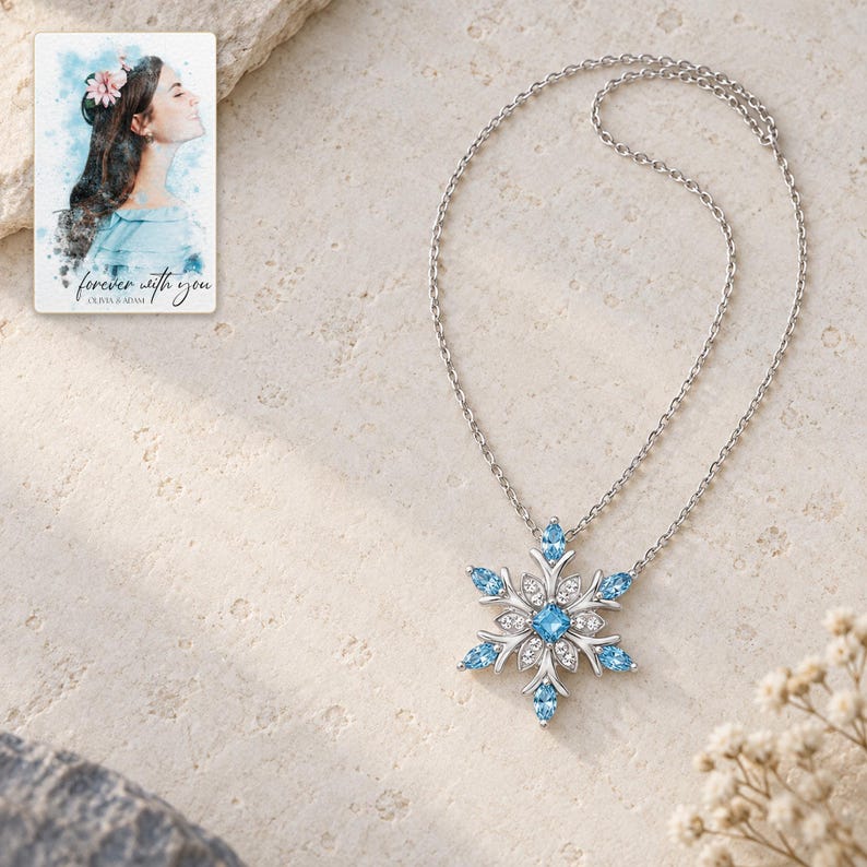 Winter Azure Snowflake Necklace shown as the main Etsy hero photograph with a clear view of the complete design. A personalized digital greeting card is shown alongside.