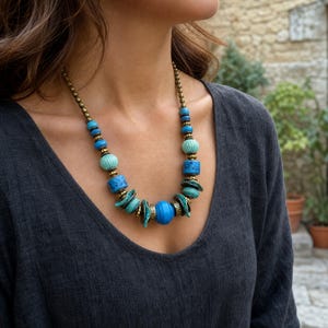Three-piece handmade necklace set featuring rose gold and brown beaded necklace, rose gold and brown beaded necklace and rose gold and brown beaded necklace, displayed together to show the coordinated colors and beadwork