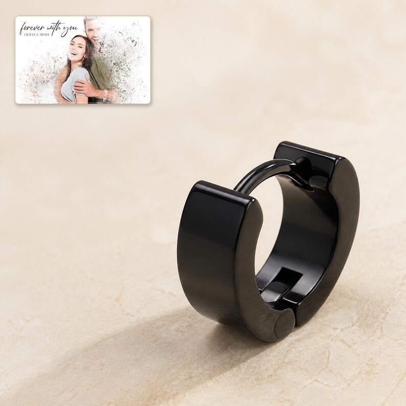 EdgeLine Stainless Huggie Hoops styled against a dark luxury surface with the exact product finish clearly visible.