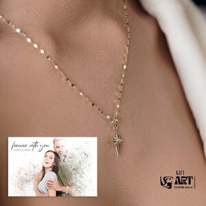 May include: A delicate gold necklace with a starburst pendant. The necklace is worn against a person's skin. A small image in the lower left corner reads "forever with you" and features a couple. The image also has the text "GIFT ART DREAM".