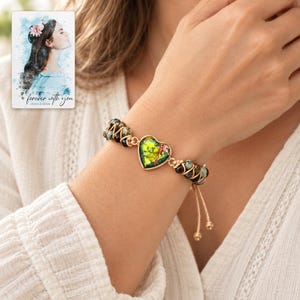 Verdant Heart Woven Bracelet worn by an adult model for styling and everyday styling. A personalized digital greeting card is shown alongside.