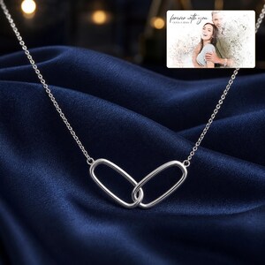 Everlinked Sterling Necklace arranged on soft ivory linen in a refined neutral flat lay.