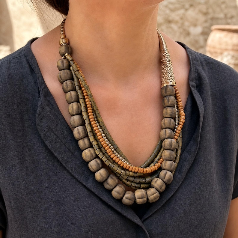 Three-piece handmade necklace set featuring rose gold and beige beaded necklace, rose gold and bronze beaded necklace and rose gold and brown beaded necklace, displayed together to show the coordinated colors and beadwork