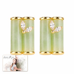 Pale green bamboo-shaped stud earrings with gold-tone edges, catalog view. A personalized greeting-card example appears in the corner.