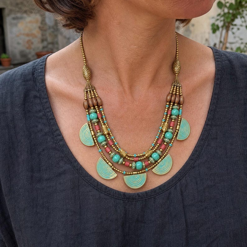 Three-piece handmade necklace set featuring gray and silver beaded necklace, brown and gray beaded necklace and gray and rose gold beaded necklace, displayed together to show the coordinated colors and beadwork