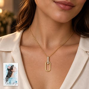 Oval Link Moissanite Necklace, worn with evening clothing. A sample personalized digital greeting card is shown alongside.