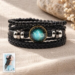 Zodiac Sign Bracelet, laid on fabric. A sample personalized digital greeting card is shown alongside.